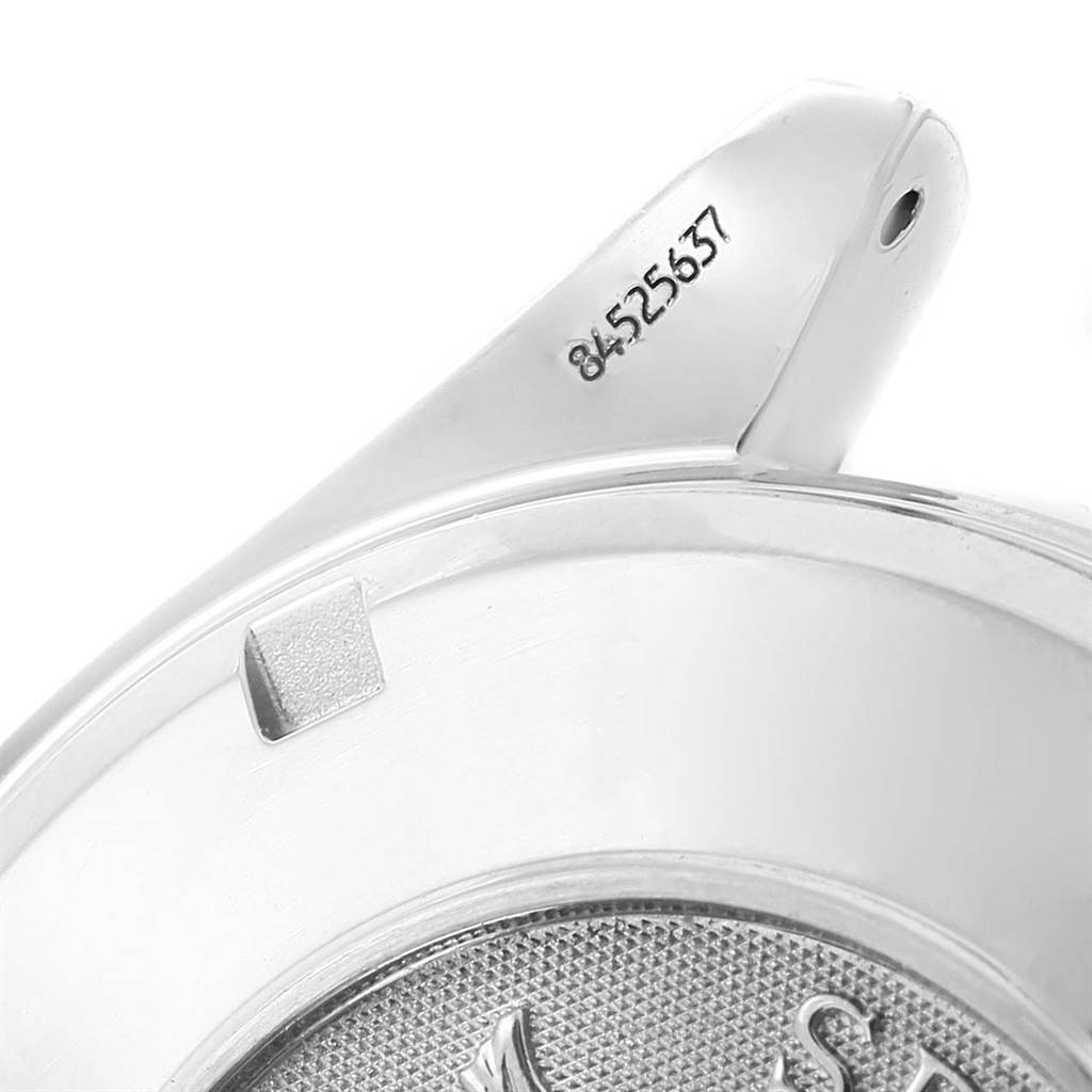 This image shows a close-up of the bracelet lug and part of the case back of an Omega Speedmaster 3210.51.00 Men
s Stainless Steel Black Dial 3210.51.00 Men
s Stainless Steel Black Dial watch.