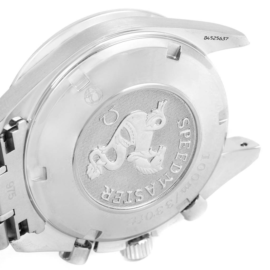 The image shows the back case of an Omega Speedmaster 3210.51.00 Men
s Stainless Steel Black Dial 3210.51.00 Men
s Stainless Steel Black Dial watch, highlighting its emblem and engravings.