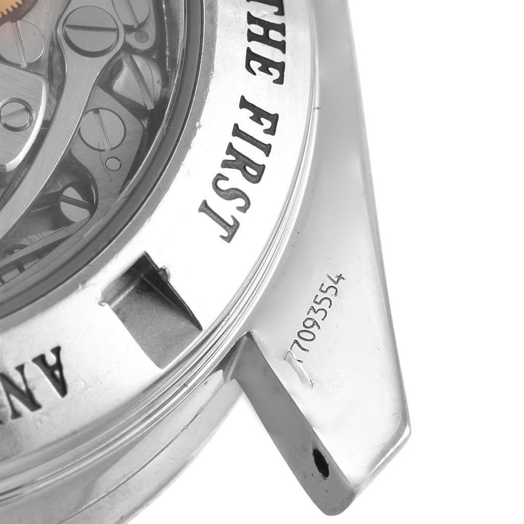 The image shows a close-up of the case back and part of the lugs of the Omega Speedmaster 3573.50.00 Men
s Stainless Steel Black Dial 3573.50.00 Men
s Stainless Steel Black Dial, revealing the serial number and movement.