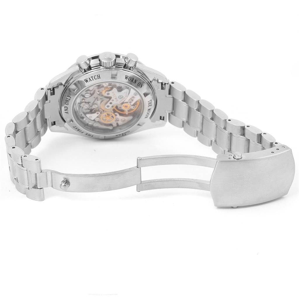 The image shows the Omega Speedmaster 3573.50.00 Men
s Stainless Steel Black Dial 3573.50.00 Men
s Stainless Steel Black Dial watch from the back with a focus on its transparent case back, bracelet, and clasp.