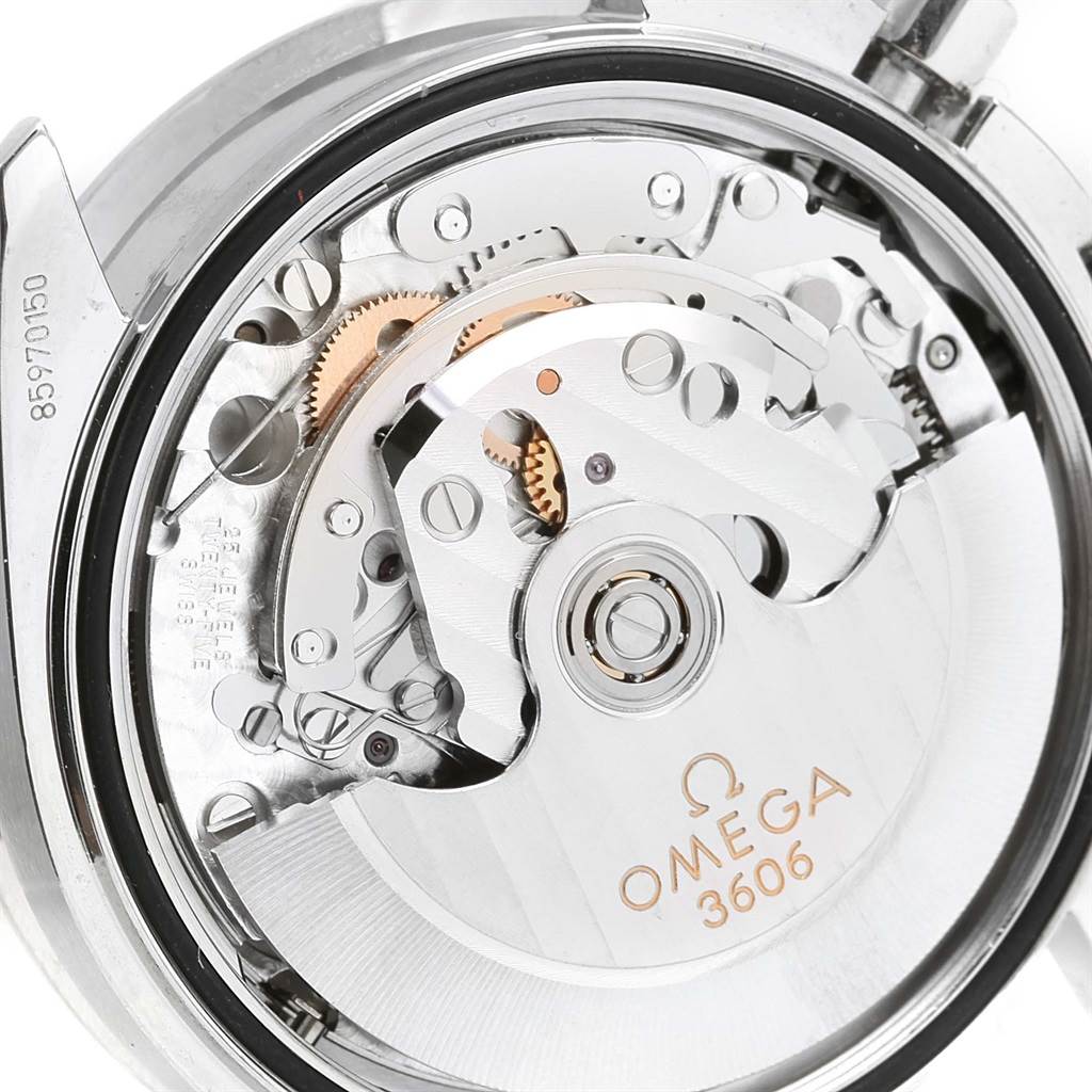 The image shows a close-up view of the Omega Speedmaster 3220.50.00 Men
s Stainless Steel Black Dial 3220.50.00 Men
s Stainless Steel Black Dial
s 3606 movement mechanism from the back.