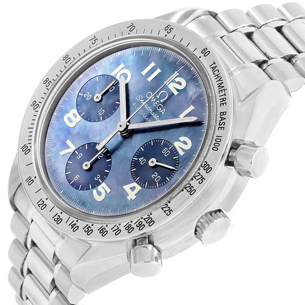 The image shows a close-up of the face and side buttons of an Omega Speedmaster 3502.73.00 Men's Stainless Steel Mother of Pearl Dial 3502.73.00 Men's Stainless Steel Mother of Pearl Dial watch, highlighting the steel bracelet and tachymeter bezel.