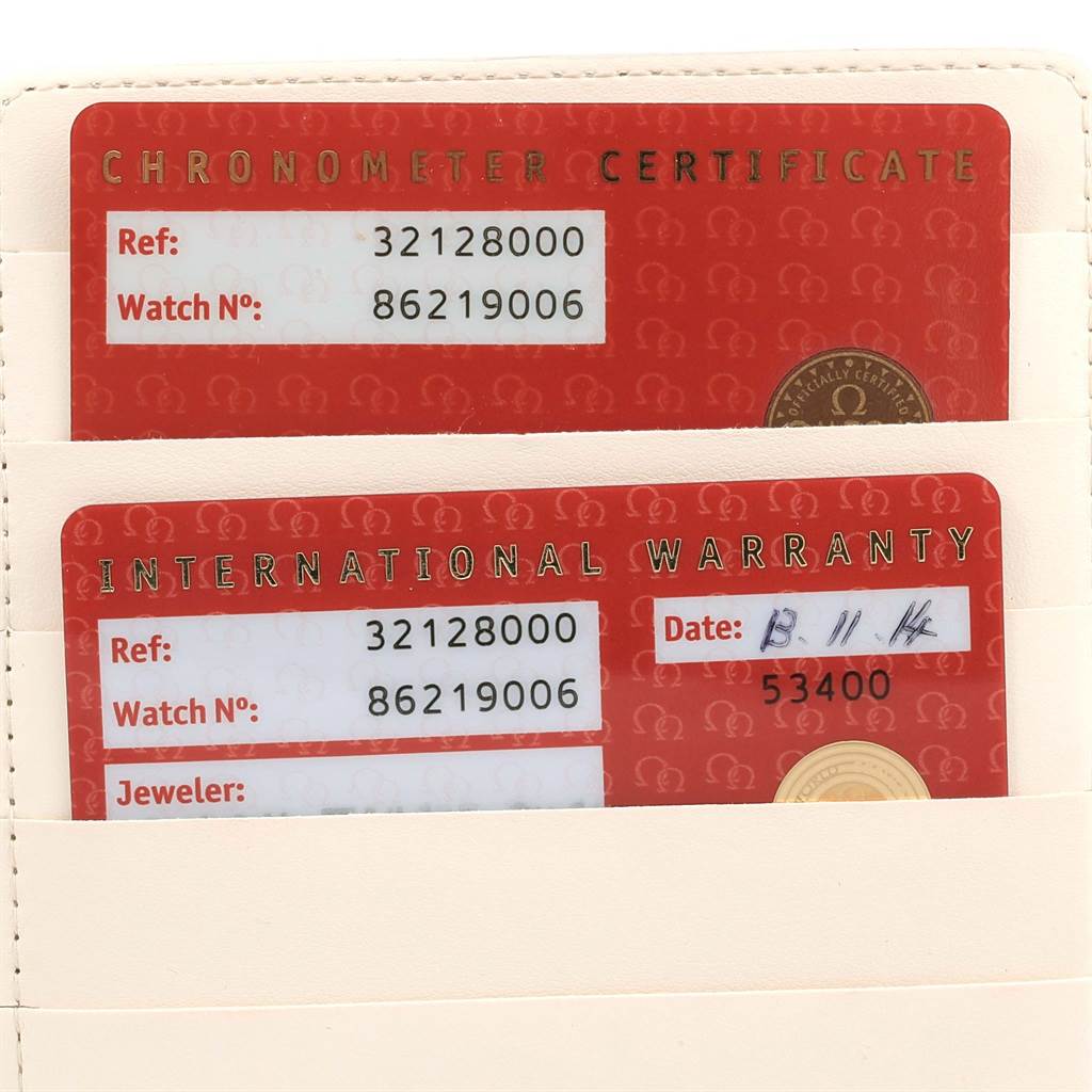 The image shows the chronometer certificate and international warranty cards for an Omega Speedmaster 3212.80.00 Men
s Stainless Steel Blue Dial 3212.80.00 Men
s Stainless Steel Blue Dial watch.