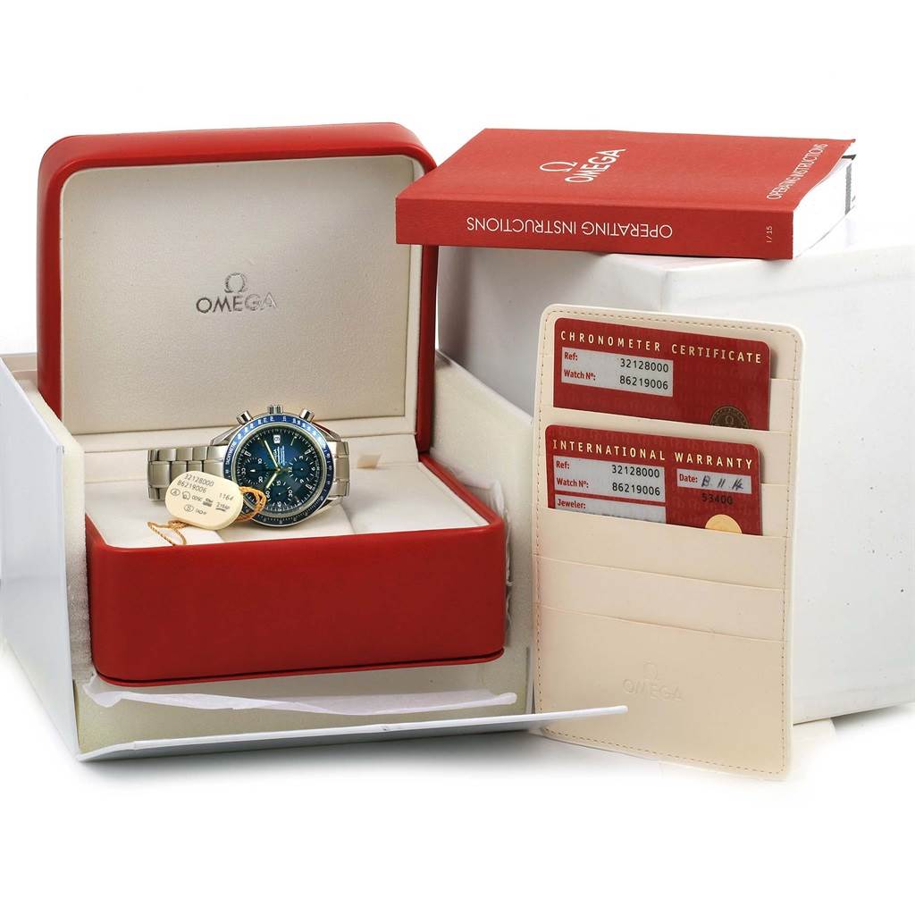 The Omega Speedmaster 3212.80.00 Men
s Stainless Steel Blue Dial 3212.80.00 Men
s Stainless Steel Blue Dial watch is shown in its open case along with its warranty cards and operating instructions.