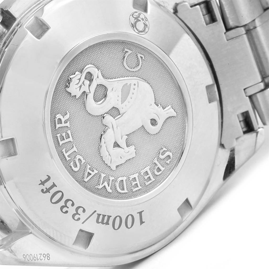 The image shows the case back of an Omega Speedmaster 3212.80.00 Men
s Stainless Steel Blue Dial 3212.80.00 Men
s Stainless Steel Blue Dial watch, focused on the emblem and engravings.