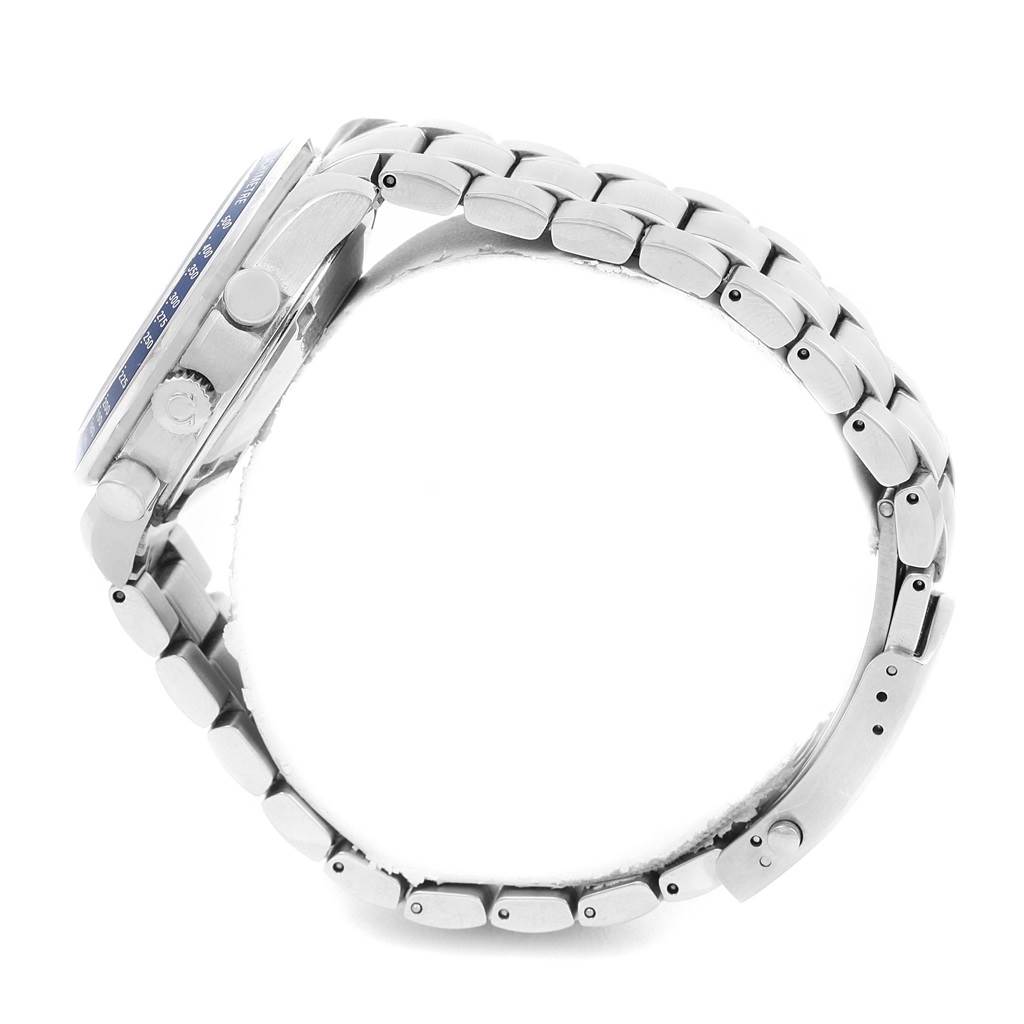 The image shows a side view of the Omega Speedmaster 3212.80.00 Men
s Stainless Steel Blue Dial 3212.80.00 Men
s Stainless Steel Blue Dial watch, highlighting the crown, pushers, and metal bracelet.