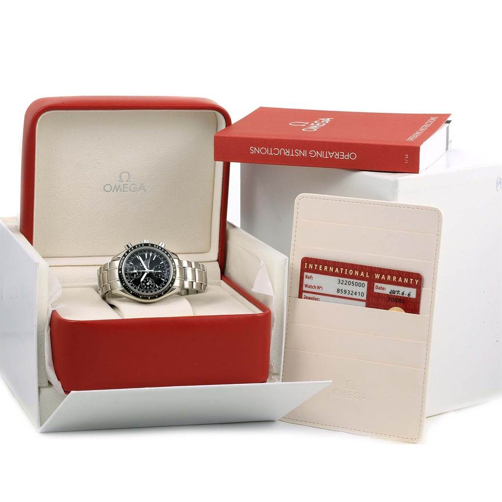 The image shows an Omega Speedmaster 3220.50.00 Men
s Stainless Steel Black Dial 3220.50.00 Men
s Stainless Steel Black Dial watch in its case, along with the operating instructions and warranty card.