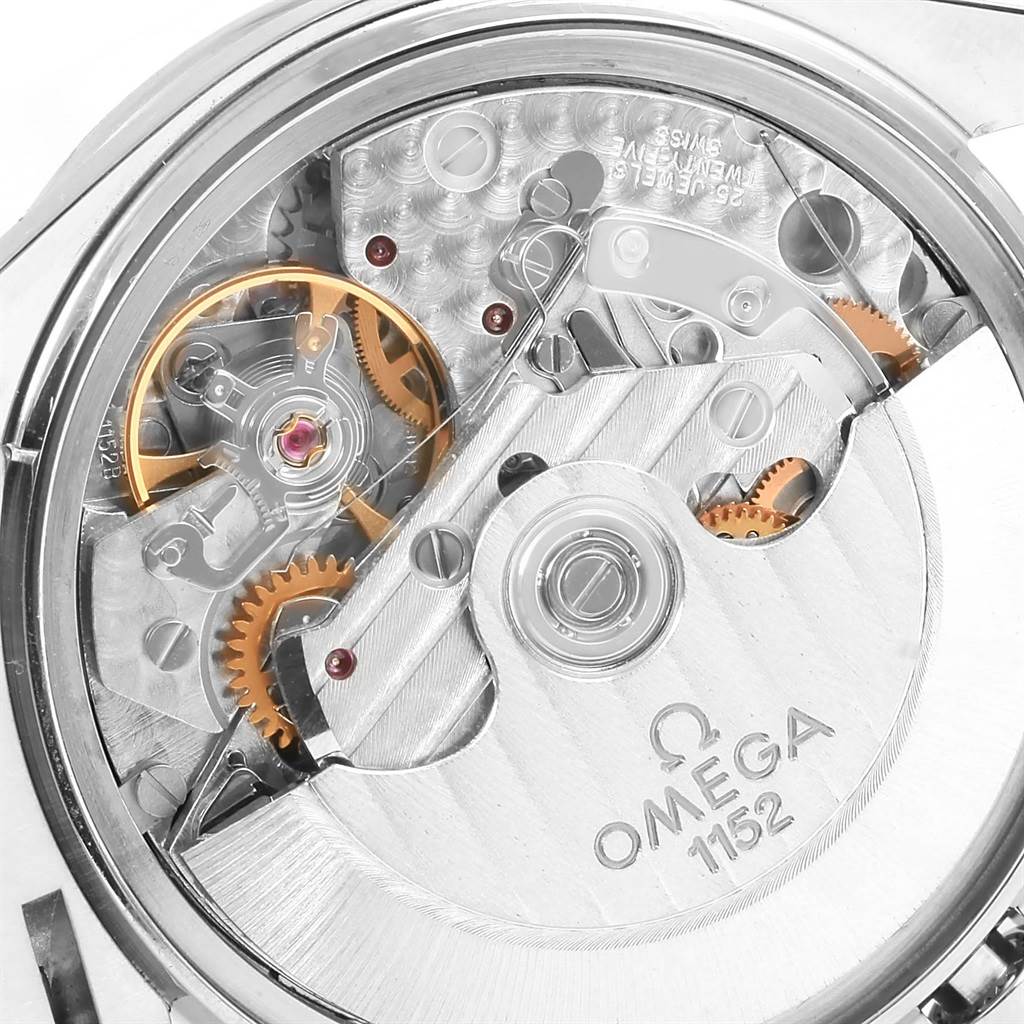 The image shows a close-up of the Omega Speedmaster 3513.54.00 Men
s Stainless Steel Black Dial 3513.54.00 Men
s Stainless Steel Black Dial
s movement, highlighting the intricate gears and precision engineering.