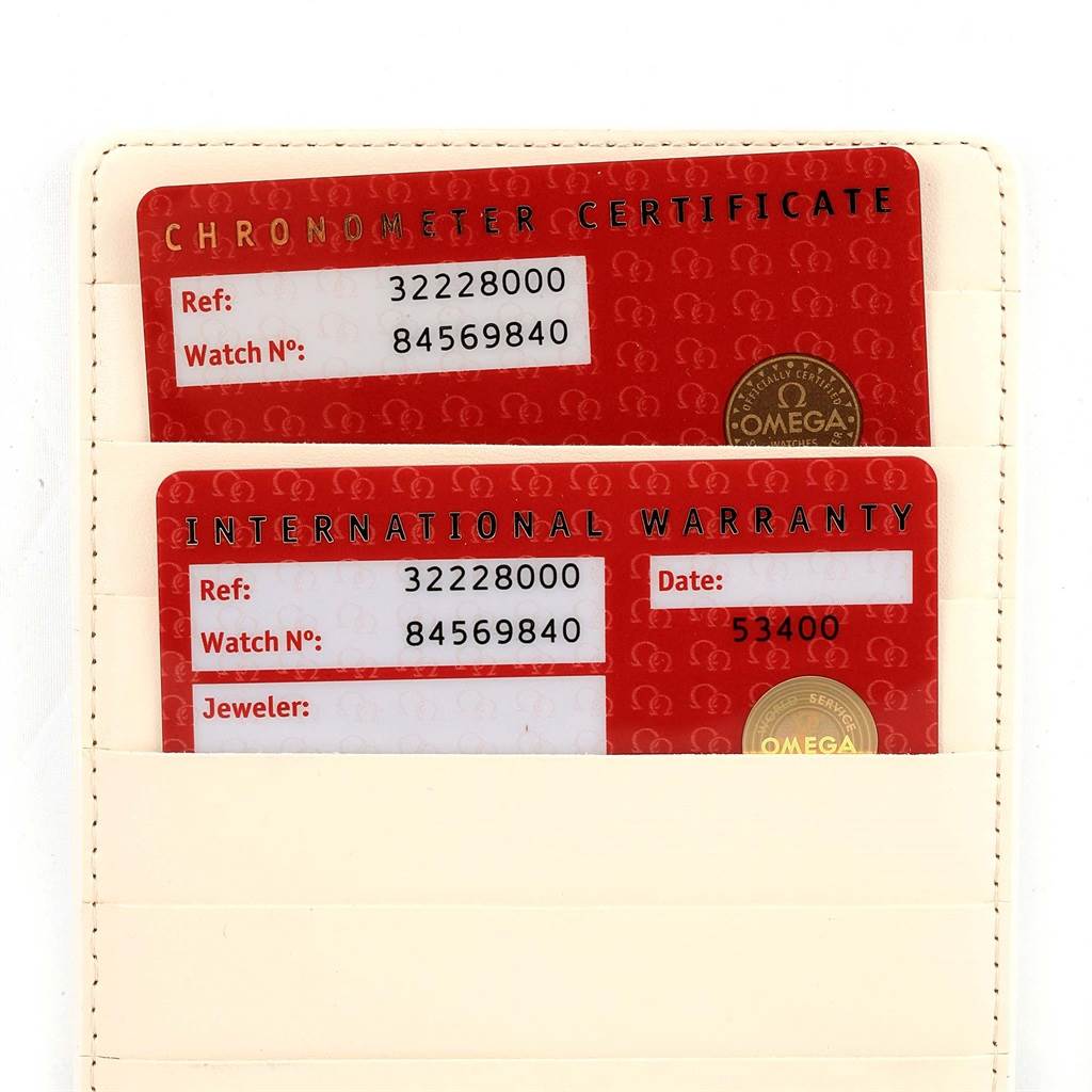 The image shows the Chronometer Certificate and International Warranty cards for the Omega Speedmaster 3222.80.00 Men
s Stainless Steel Blue Dial 3222.80.00 Men
s Stainless Steel Blue Dial watch.