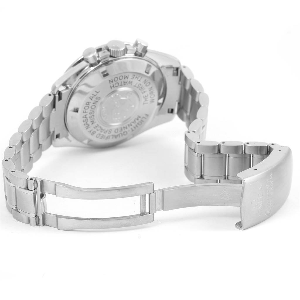 The image shows the backside of an Omega Speedmaster 3570.50.00 Men
s Stainless Steel Black Dial 3570.50.00 Men
s Stainless Steel Black Dial watch with the metal bracelet and clasp open.