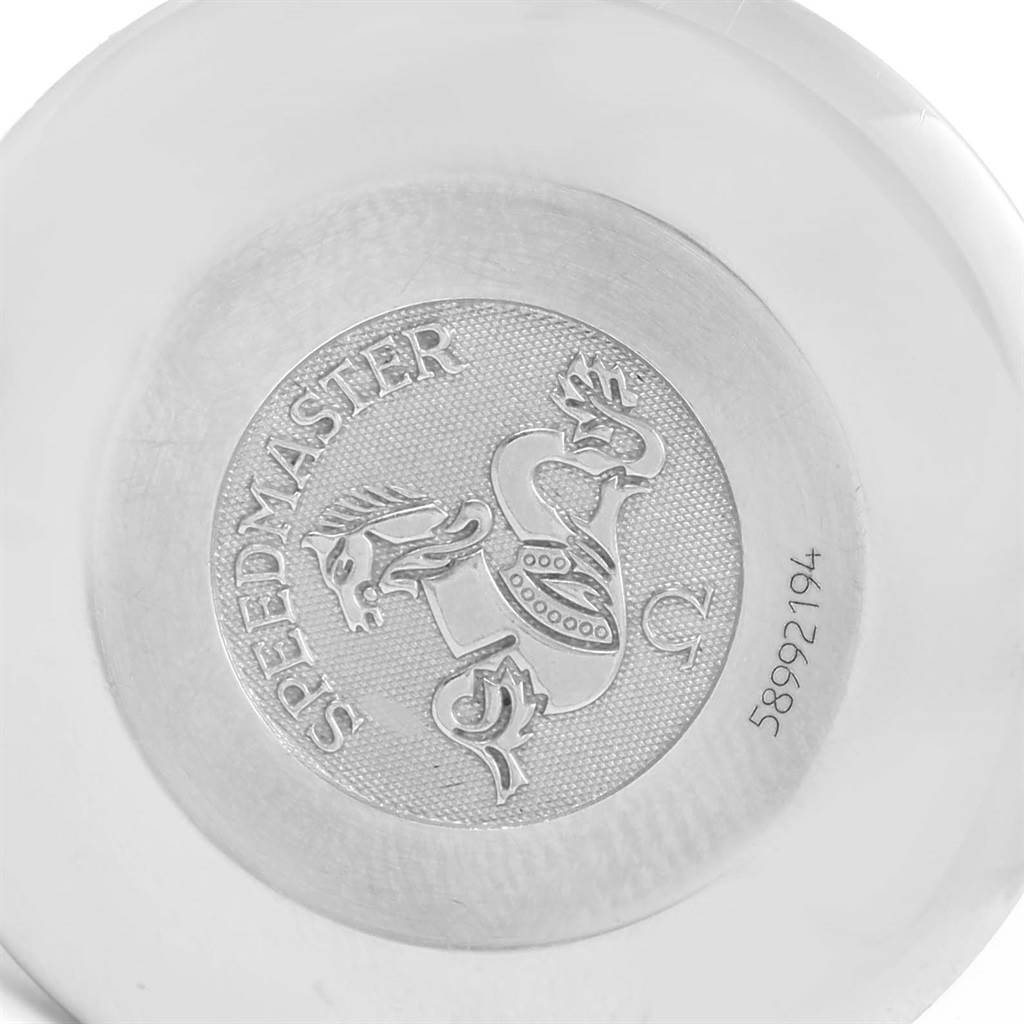 The image shows the backside of an Omega Speedmaster 3520.50.00 Men
s Stainless Steel Black Dial 3520.50.00 Men
s Stainless Steel Black Dial watch with its logo and serial number engraved.