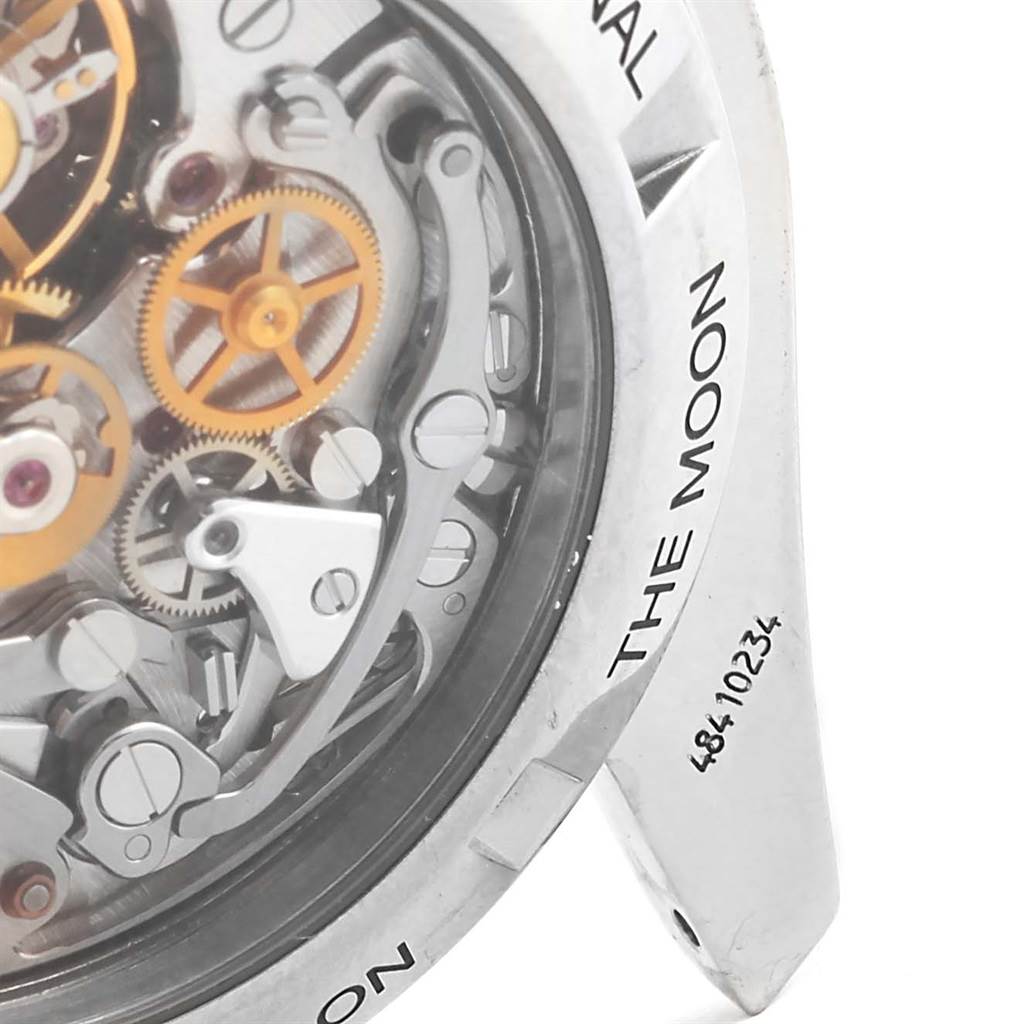 This image shows a close-up angle of the Omega Speedmaster 3572.50.00 Men
s Stainless Steel Black Dial 3572.50.00 Men
s Stainless Steel Black Dial
s internal mechanism and part of the case back engraving.