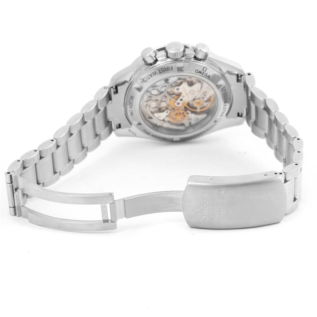 The image shows the Omega Speedmaster 3572.50.00 Men
s Stainless Steel Black Dial 3572.50.00 Men
s Stainless Steel Black Dial watch from the back, revealing its deployment clasp and exhibition case back.