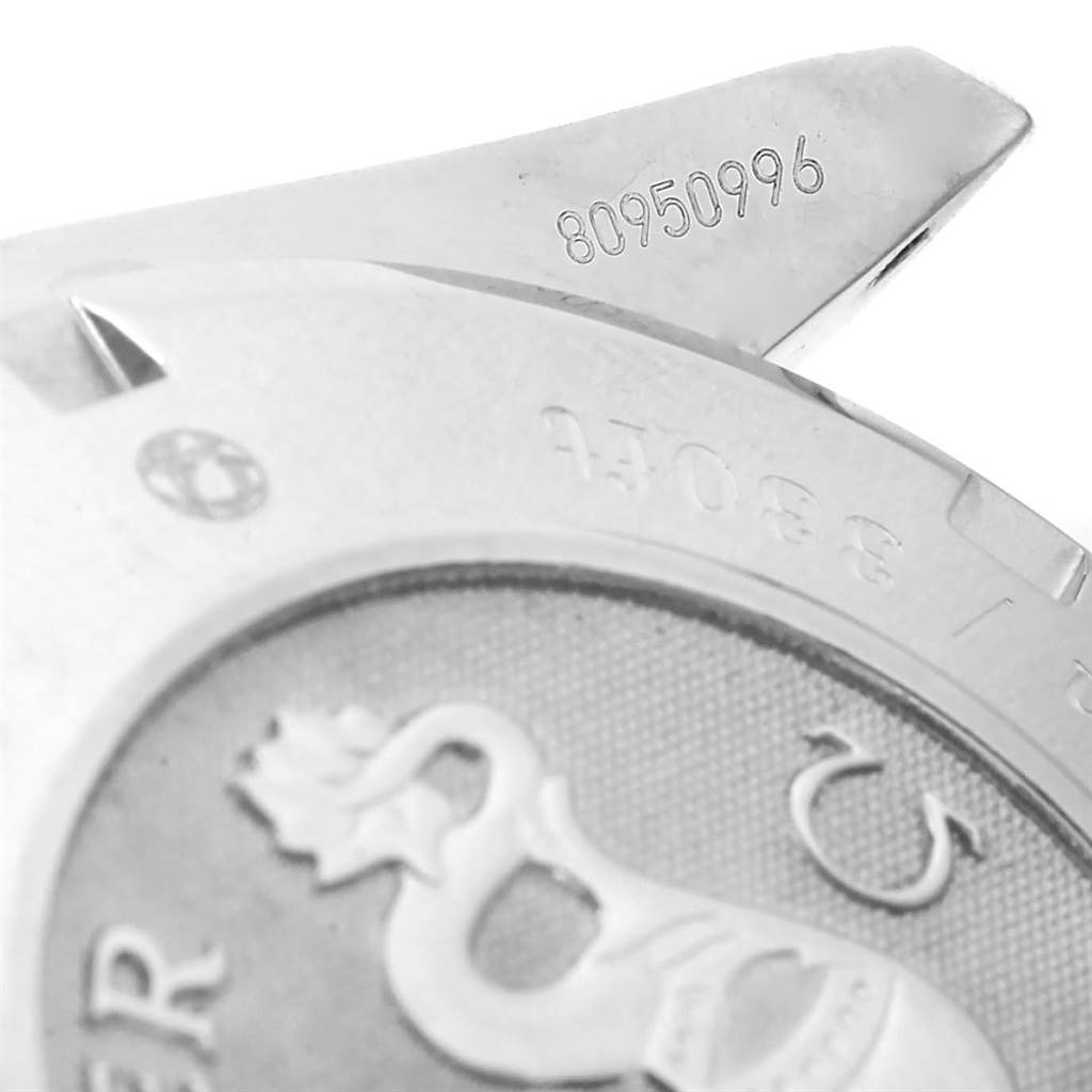 The image shows a close-up of the back case and serial number of an Omega Speedmaster 323.30.40.40.02.001 Men's Stainless Steel White Dial 323.30.40.40.02.001 Men's Stainless Steel White Dial watch.