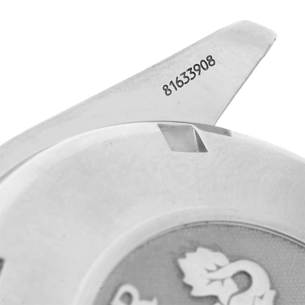 This close-up shows part of the case back and serial number of an Omega Speedmaster 3222.80.00 Men
s Stainless Steel Blue Dial 3222.80.00 Men
s Stainless Steel Blue Dial watch.