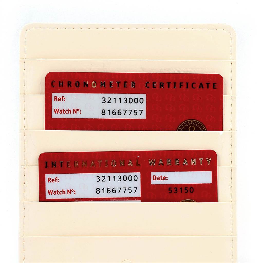 The image shows the Chronometer Certificate and International Warranty cards for the Omega Speedmaster 3211.30.00 Men
s Stainless Steel Silver Dial 3211.30.00 Men
s Stainless Steel Silver Dial watch.