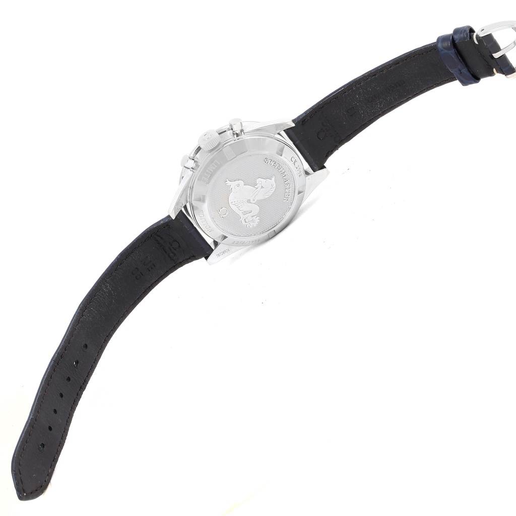 The image shows the back and strap of an Omega Speedmaster 311.33.40.30.02.001 Men's Stainless Steel Silver Dial 311.33.40.30.02.001 Men's Stainless Steel Silver Dial watch, highlighting the case back engraving and leather strap.