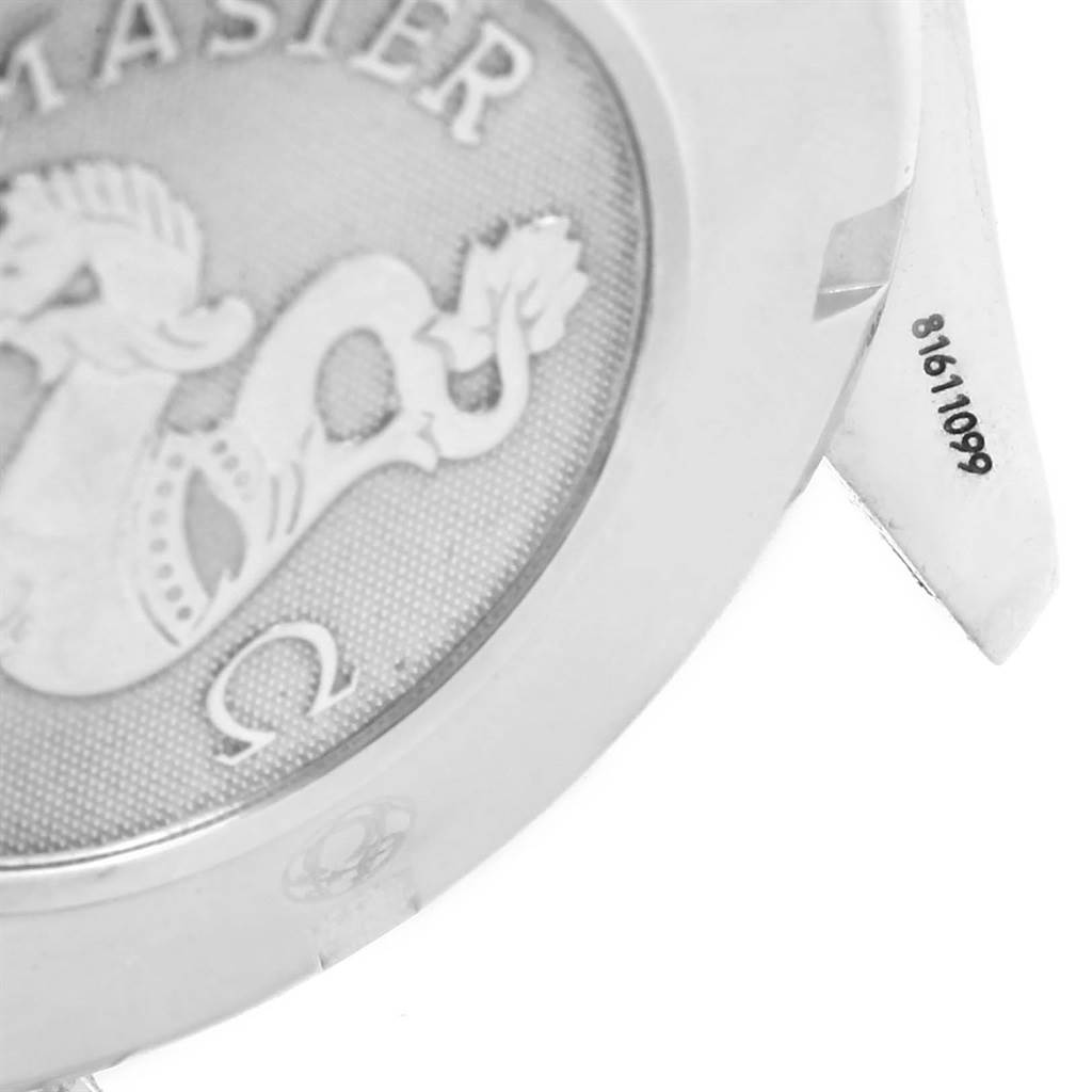The image shows a close-up of the back case and serial number on the lug of an Omega Speedmaster 3211.31.00 Men
s Stainless Steel Silver Dial 3211.31.00 Men
s Stainless Steel Silver Dial watch.