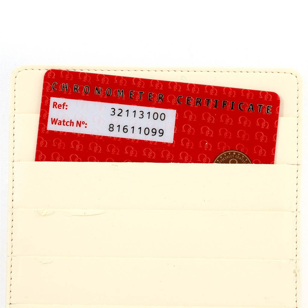 The image shows the reference and watch number card for an Omega Speedmaster 3211.31.00 Men
s Stainless Steel Silver Dial 3211.31.00 Men
s Stainless Steel Silver Dial, partially inside a cardholder.