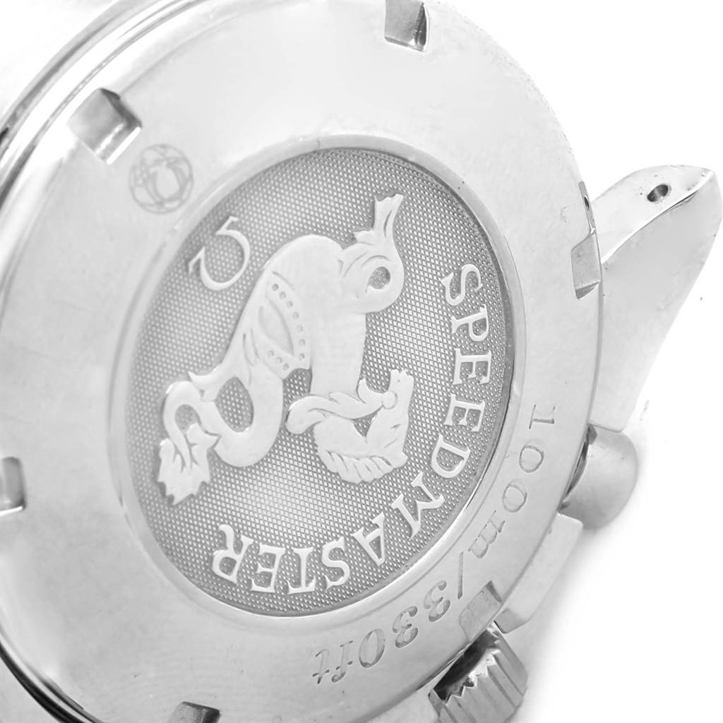 This is a close-up view of the back case of an Omega Speedmaster 3220.50.00 Men
s Stainless Steel Black Dial 3220.50.00 Men
s Stainless Steel Black Dial watch.