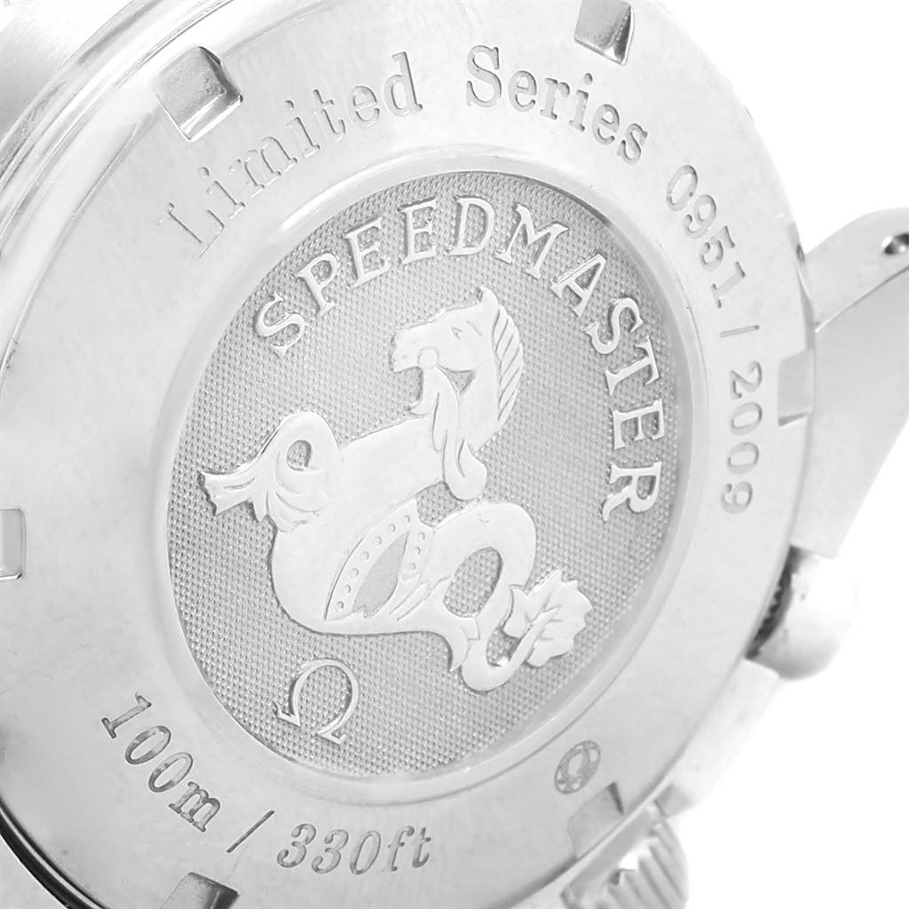 The image shows the engraved case back of the Omega Speedmaster 323.30.40.40.02.001 Men's Stainless Steel White Dial 323.30.40.40.02.001 Men's Stainless Steel White Dial watch from an angled side view.