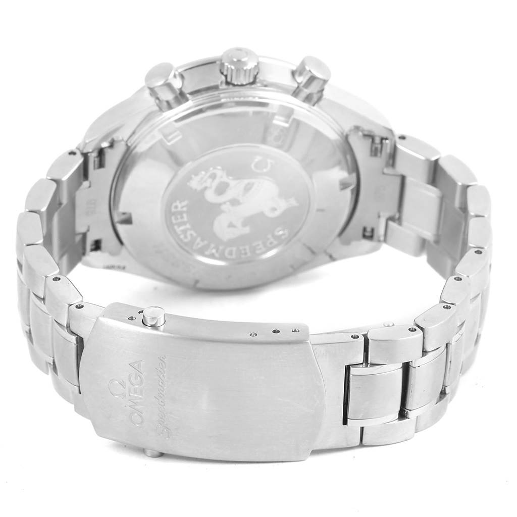 The image shows the back and clasp of the Omega Speedmaster 3220.50.00 Men
s Stainless Steel Black Dial 3220.50.00 Men
s Stainless Steel Black Dial watch, highlighting its engraved case back and metal bracelet.
