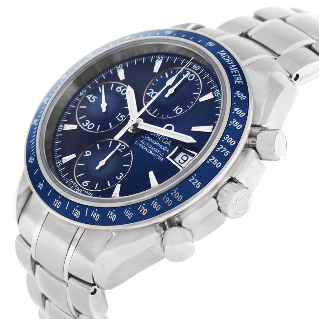The image shows an Omega Speedmaster 3212.80.00 Men
s Stainless Steel Blue Dial 3212.80.00 Men
s Stainless Steel Blue Dial watch at a three-quarter angle, highlighting its dial, tachymeter bezel, and stainless steel bracelet.