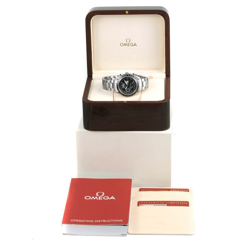 The Omega Speedmaster 3220.50.00 Men
s Stainless Steel Black Dial 3220.50.00 Men
s Stainless Steel Black Dial watch is displayed in a box with its operating instructions and warranty cards shown in front.