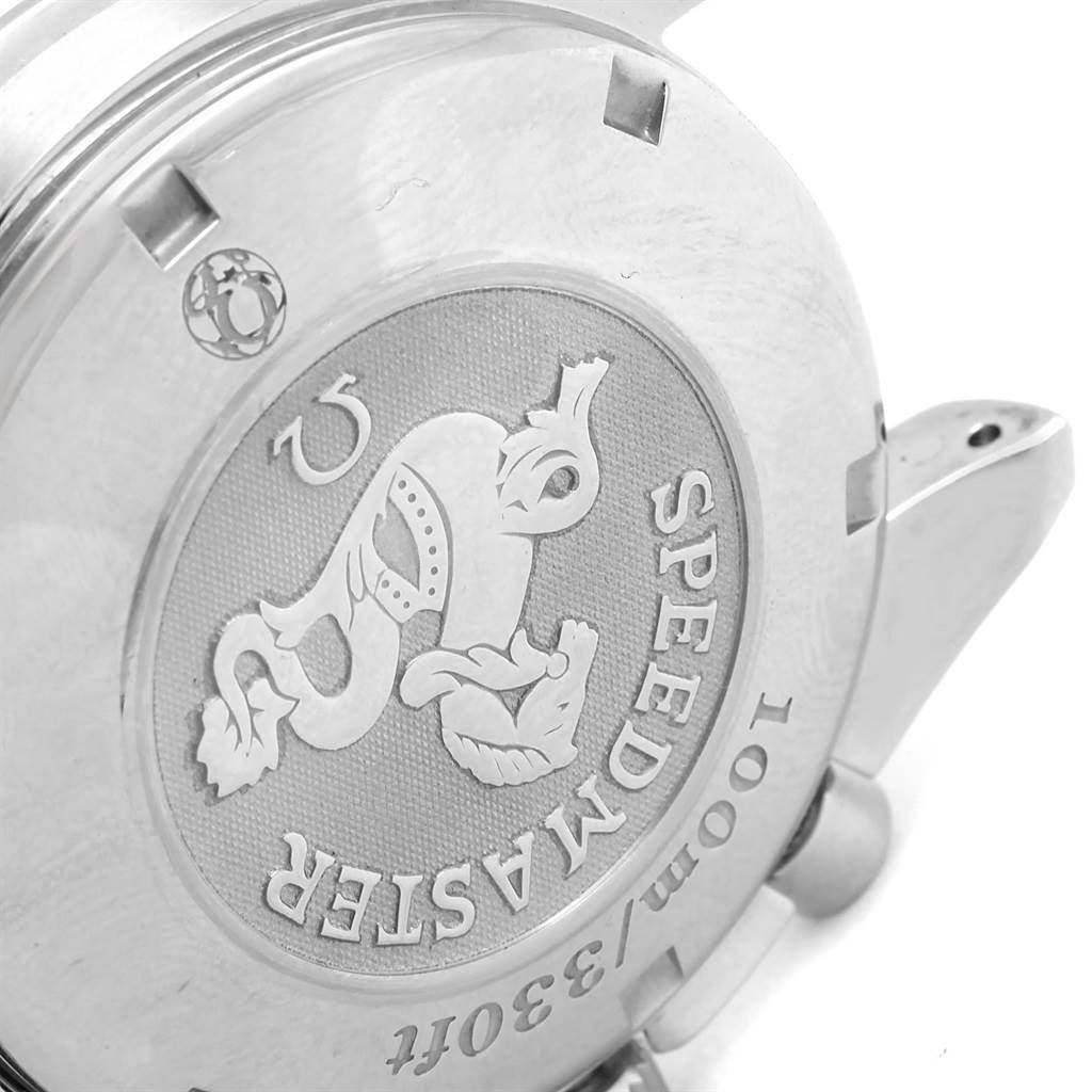 This image shows a close-up of the back case of an Omega Speedmaster 3220.50.00 Men
s Stainless Steel Black Dial 3220.50.00 Men
s Stainless Steel Black Dial watch, highlighting the engraved logo and text.