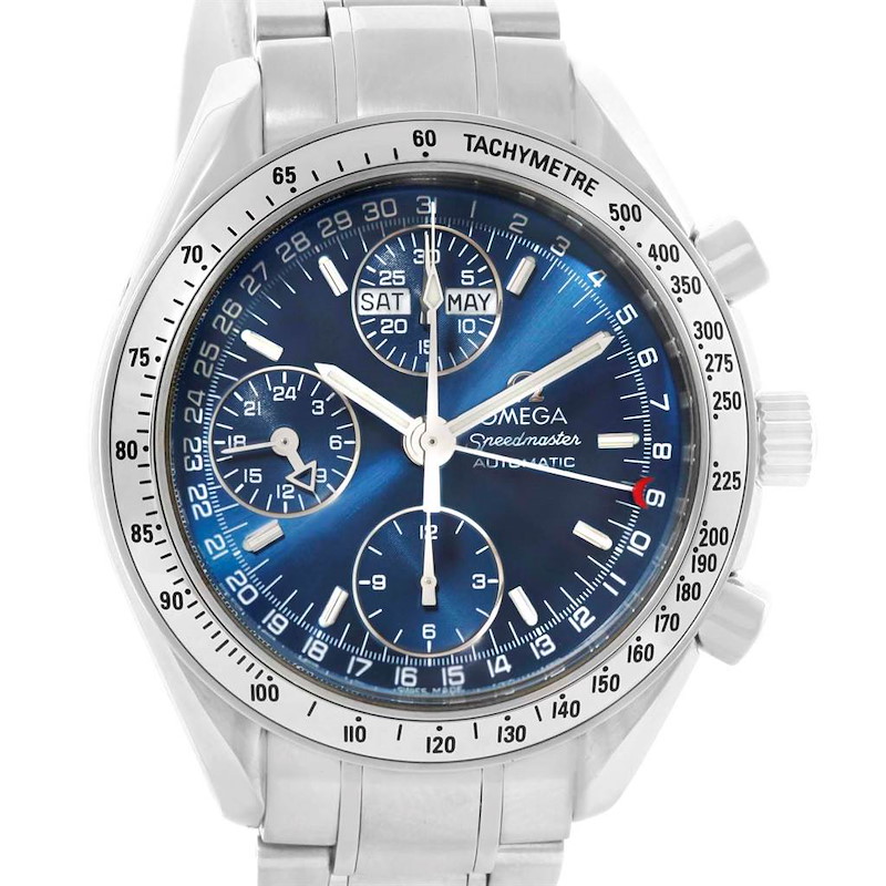 This image shows a front view of an Omega Speedmaster watch, highlighting its blue dial, chronograph subdials, tachymeter bezel, and stainless steel bracelet.