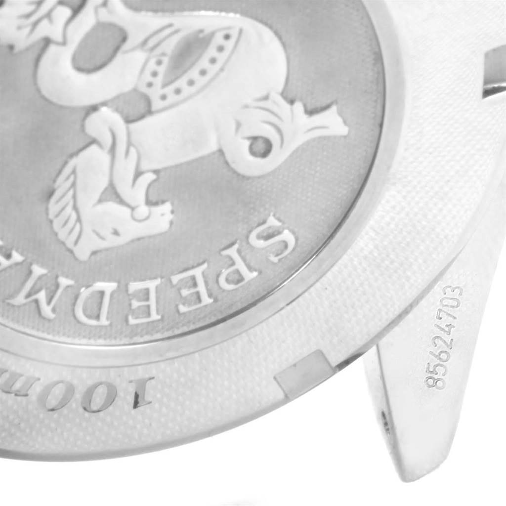 This image shows the back casing of an Omega Speedmaster 323.30.40.40.06.001 Men's Stainless Steel Grey Dial 323.30.40.40.06.001 Men's Stainless Steel Grey Dial watch with engraved details and serial number.