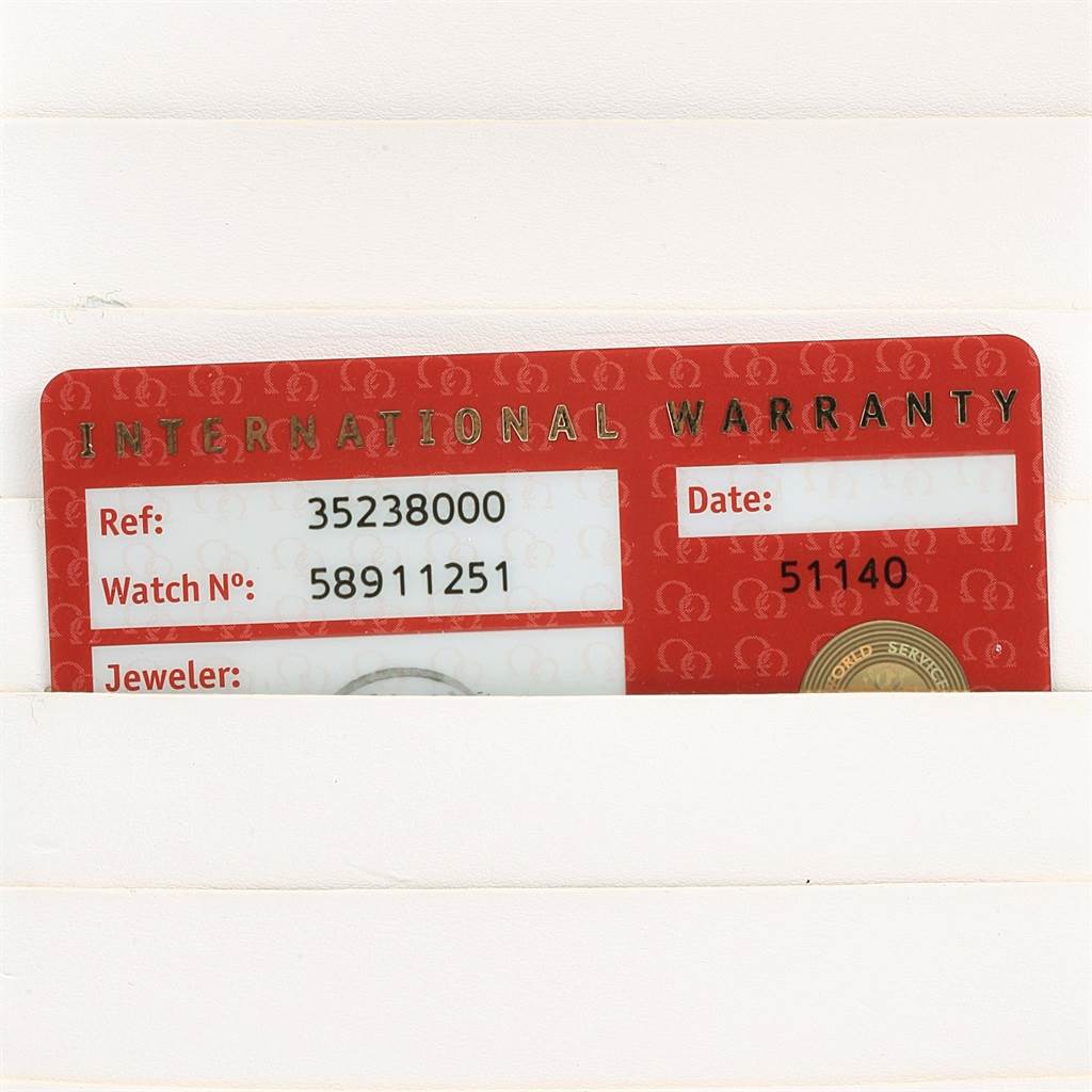 The image shows an Omega Speedmaster 3523.80.00 Men
s Stainless Steel Blue Dial 3523.80.00 Men
s Stainless Steel Blue Dial international warranty card, displaying the reference and watch numbers.