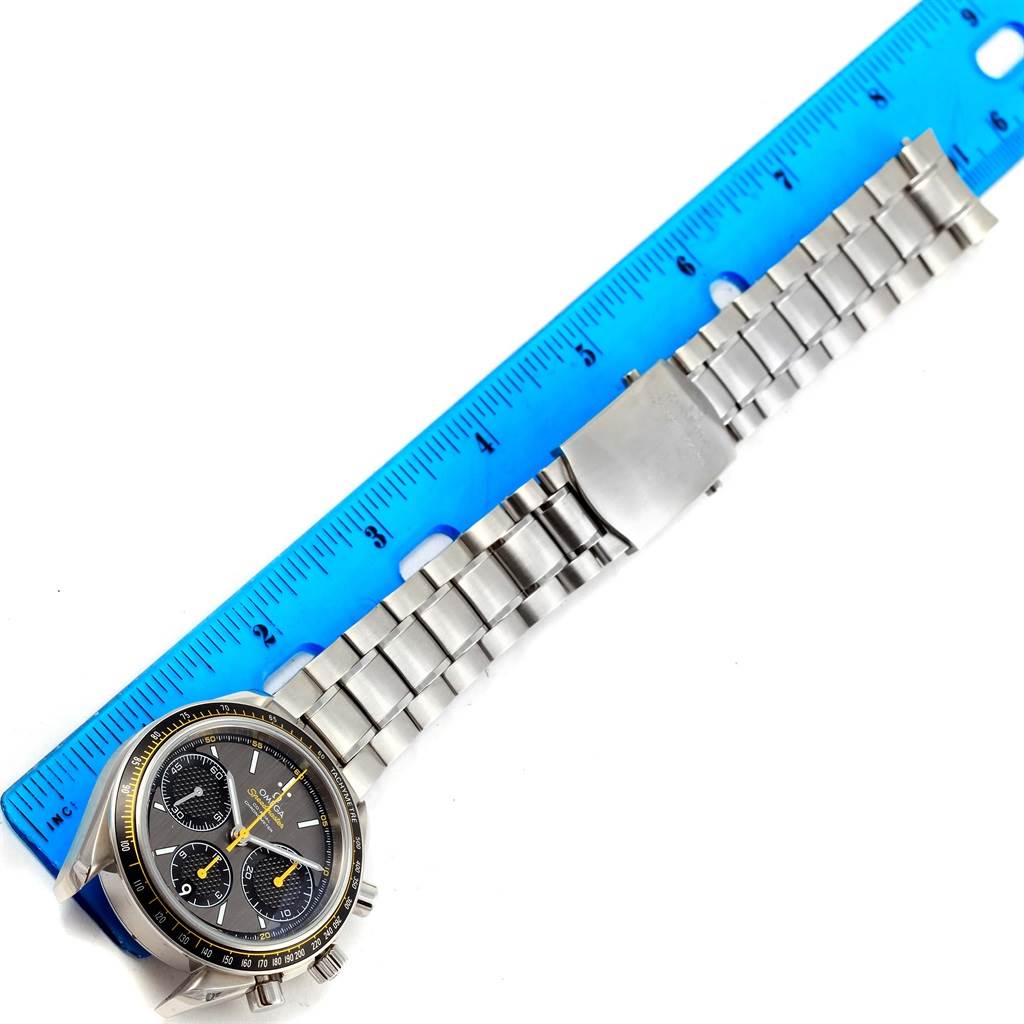 The image shows an Omega Speedmaster 326.30.40.50.06.001 Men
s Stainless Steel Grey Dial 326.30.40.50.06.001 Men
s Stainless Steel Grey Dial watch from a top-down angle, including the face and stainless steel bracelet measured by a blue ruler.