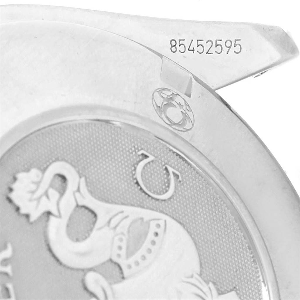 The image shows a close-up of the case back of an Omega Speedmaster 3210.52.00 Men
s Stainless Steel Black Dial 3210.52.00 Men
s Stainless Steel Black Dial watch, featuring a seahorse engraving and a serial number.