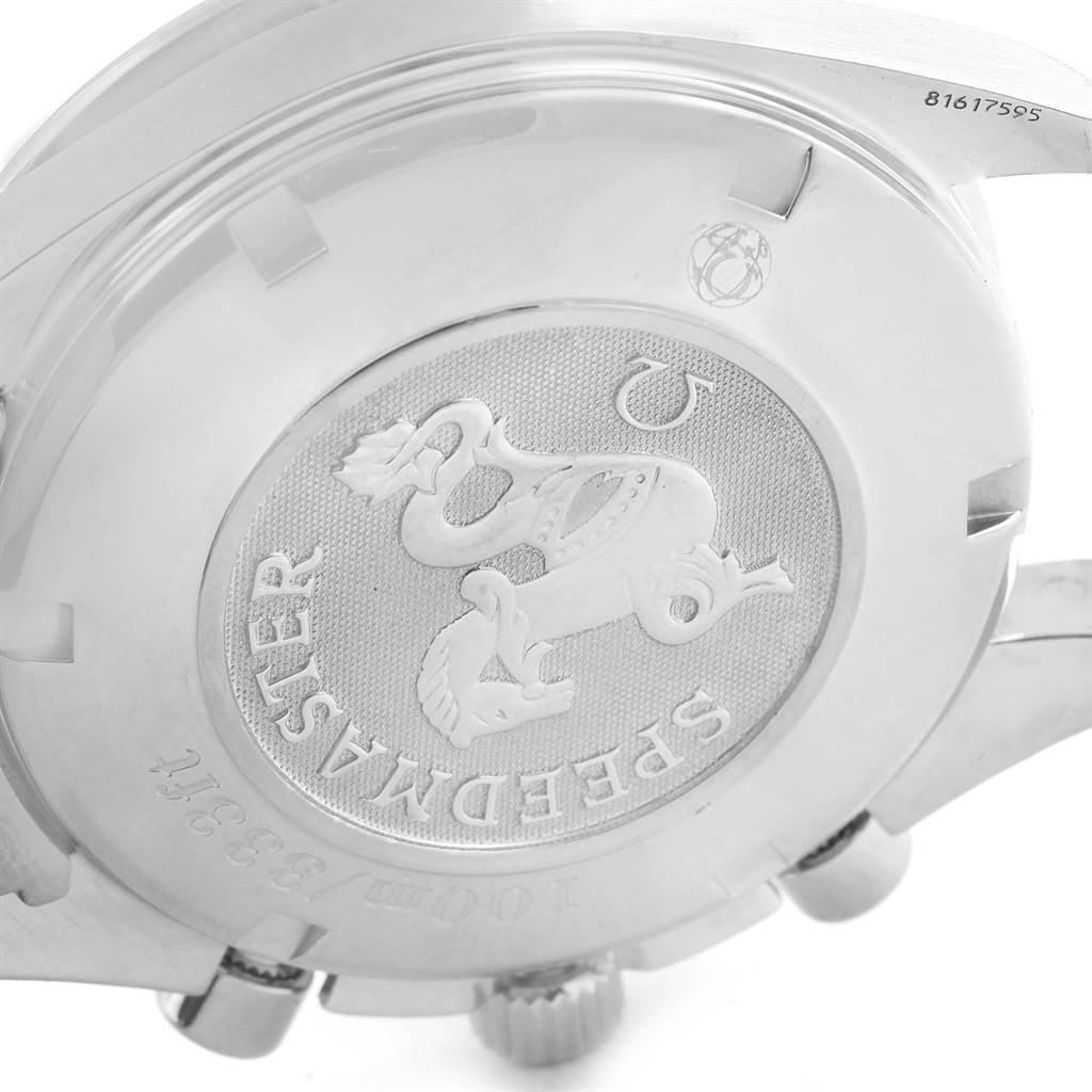 The image shows the back case of the Omega Speedmaster 3212.80.00 Men
s Stainless Steel Blue Dial 3212.80.00 Men
s Stainless Steel Blue Dial watch at an angled close-up, highlighting its engraved details.