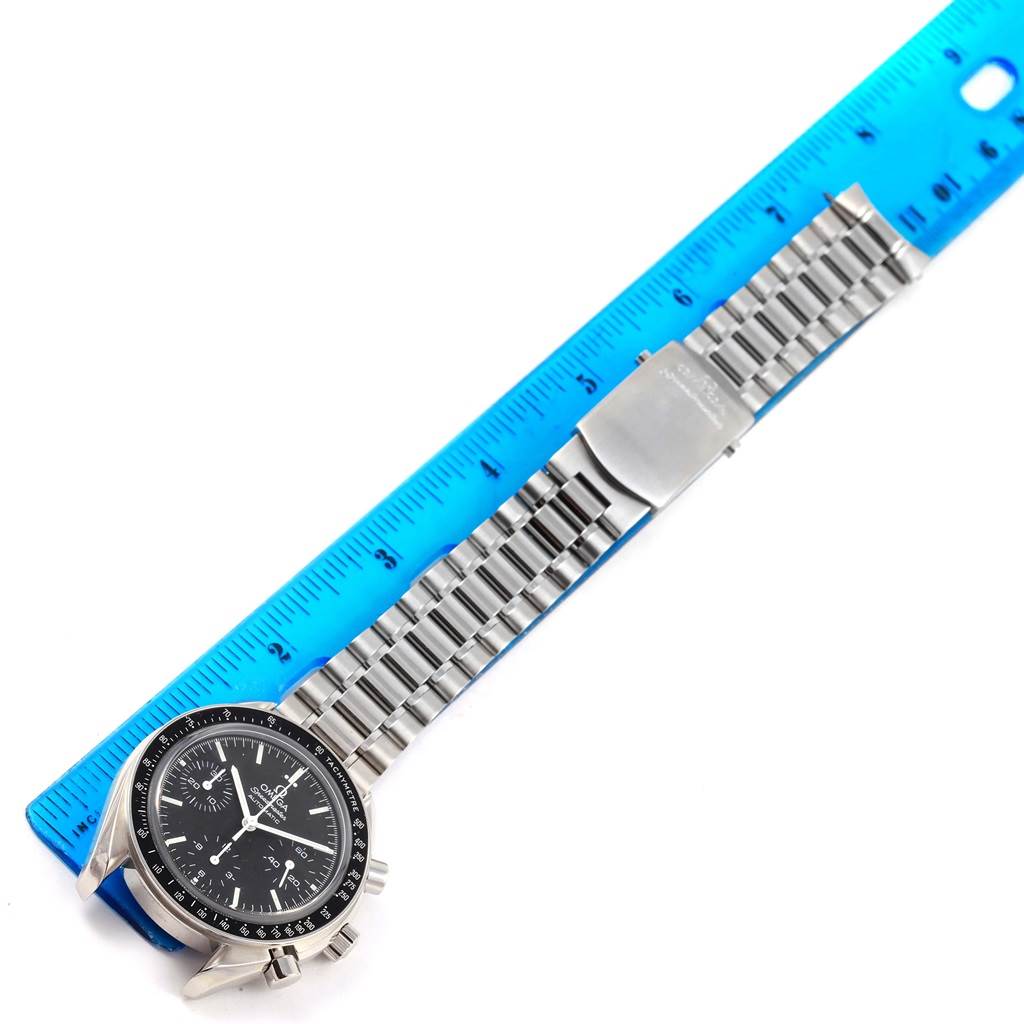 The Omega Speedmaster 3539.50.00 Men
s Stainless Steel Black Dial 3539.50.00 Men
s Stainless Steel Black Dial watch is photographed from above, displaying the face, bracelet, and clasp next to a blue ruler for scale.