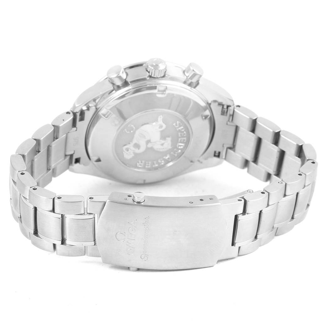 The image shows the back of the Omega Speedmaster 3222.80.00 Men
s Stainless Steel Blue Dial 3222.80.00 Men
s Stainless Steel Blue Dial watch and its metallic bracelet clasp.