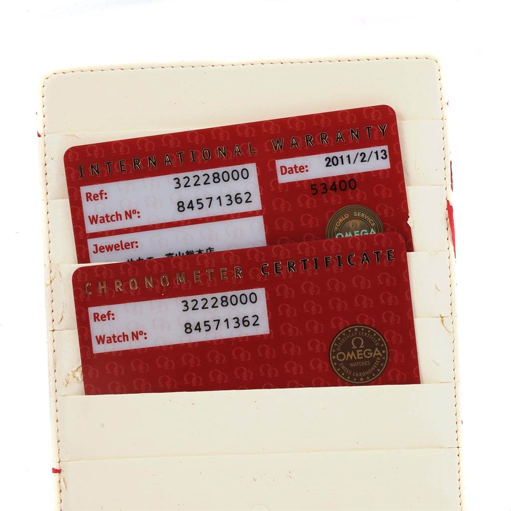 The image shows the International Warranty and Chronometer Certificate cards for an Omega Speedmaster 3222.80.00 Men
s Stainless Steel Blue Dial 3222.80.00 Men
s Stainless Steel Blue Dial watch.