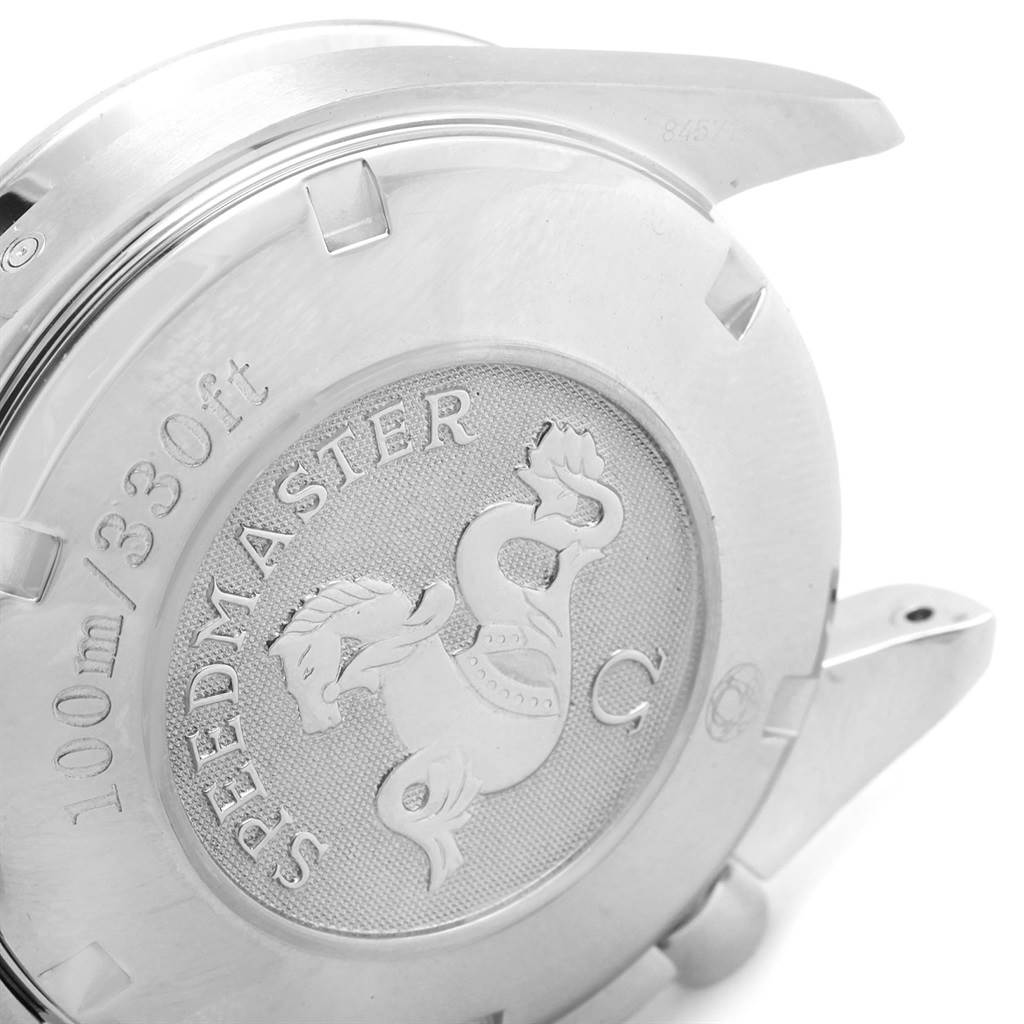 This image shows the backside case of an Omega Speedmaster 3222.80.00 Men
s Stainless Steel Blue Dial 3222.80.00 Men
s Stainless Steel Blue Dial watch, highlighting the engraved emblem and water resistance rating.