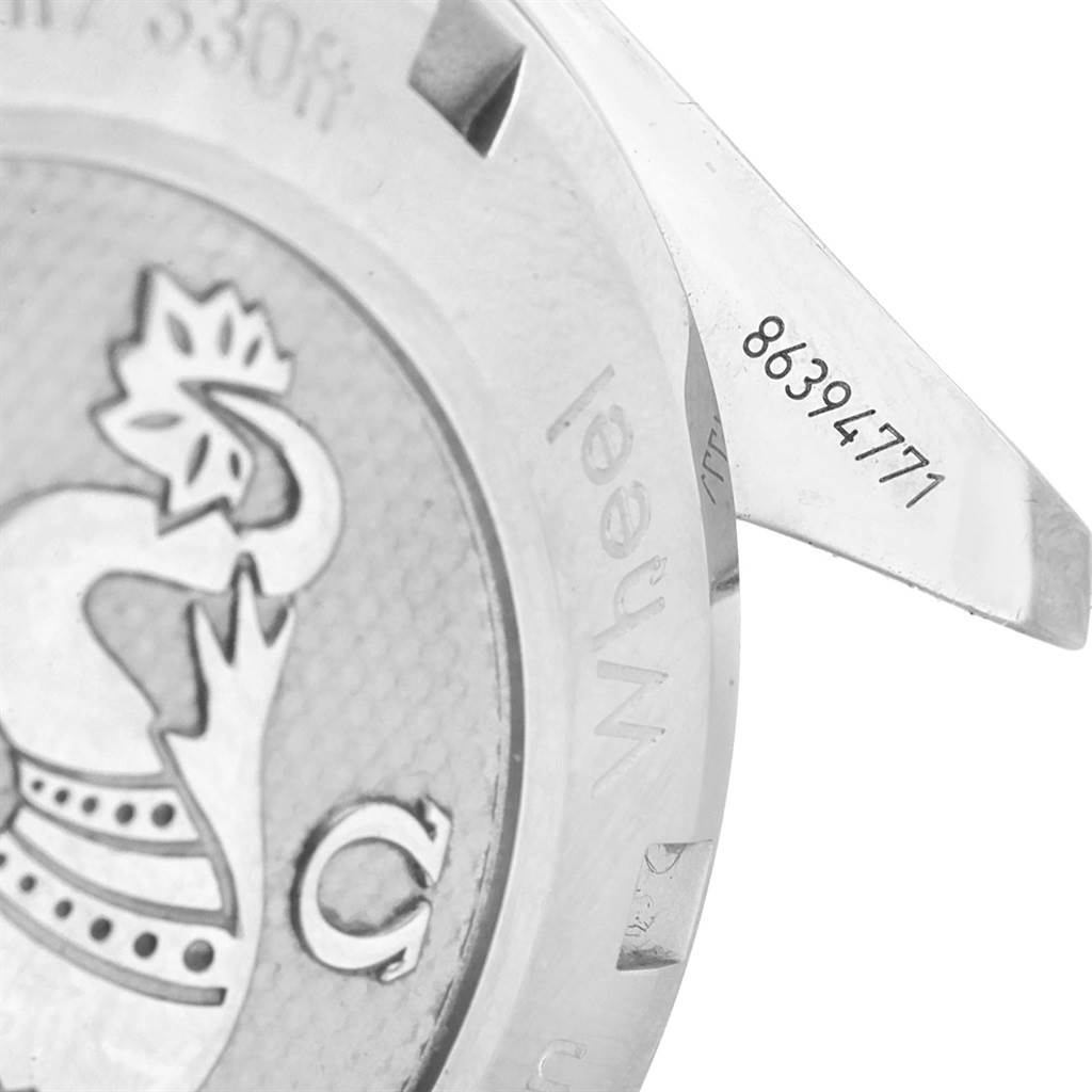 The image shows a close-up of the case back and a lug of the Omega Speedmaster 326.30.40.50.04.001 Men
s Stainless Steel White Dial 326.30.40.50.04.001 Men
s Stainless Steel White Dial watch, featuring the engraved serial number.