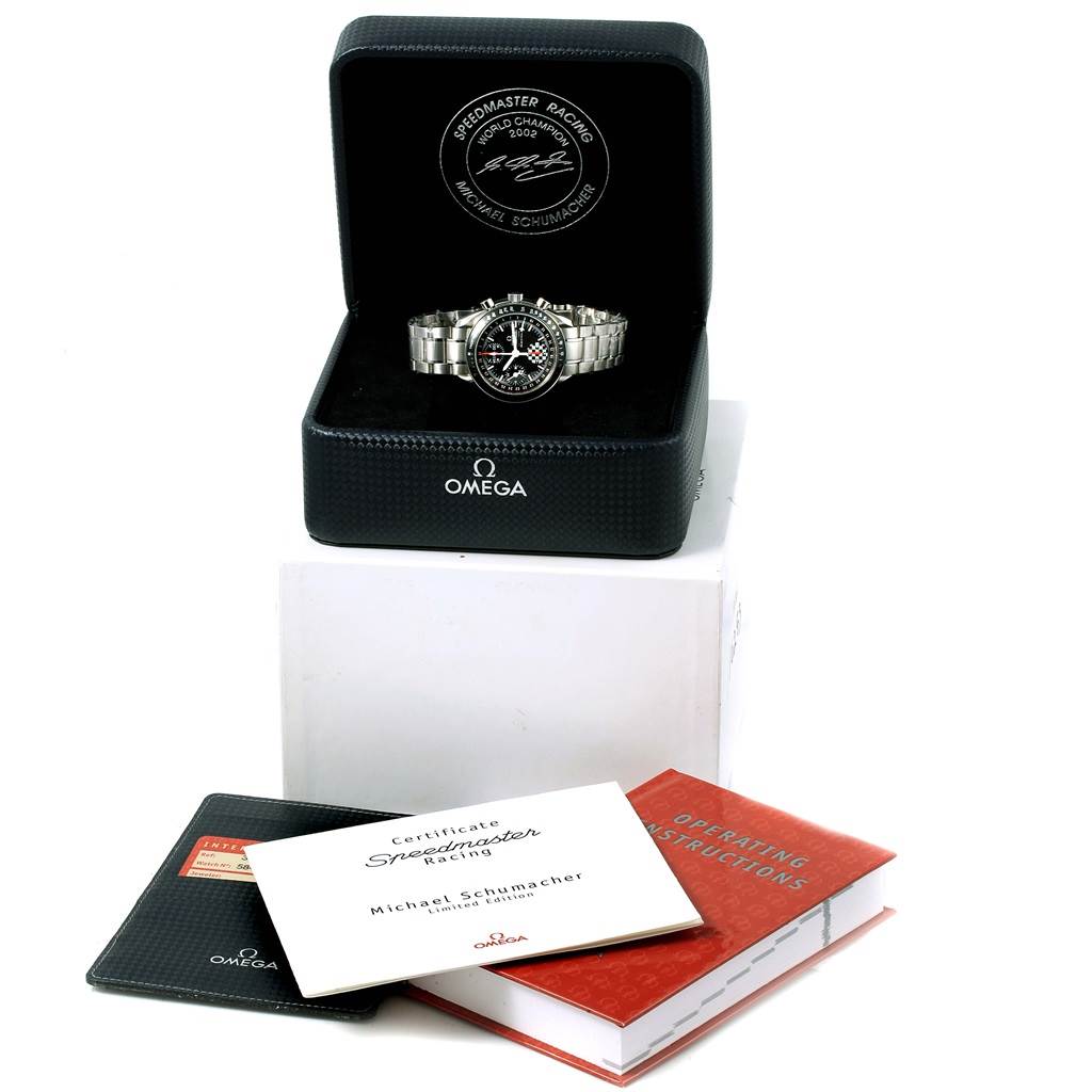 The image shows the Omega Speedmaster 3529.50.00 Men
s Stainless Steel Black Dial 3529.50.00 Men
s Stainless Steel Black Dial watch in its box, with accompanying certificates and instruction manuals.