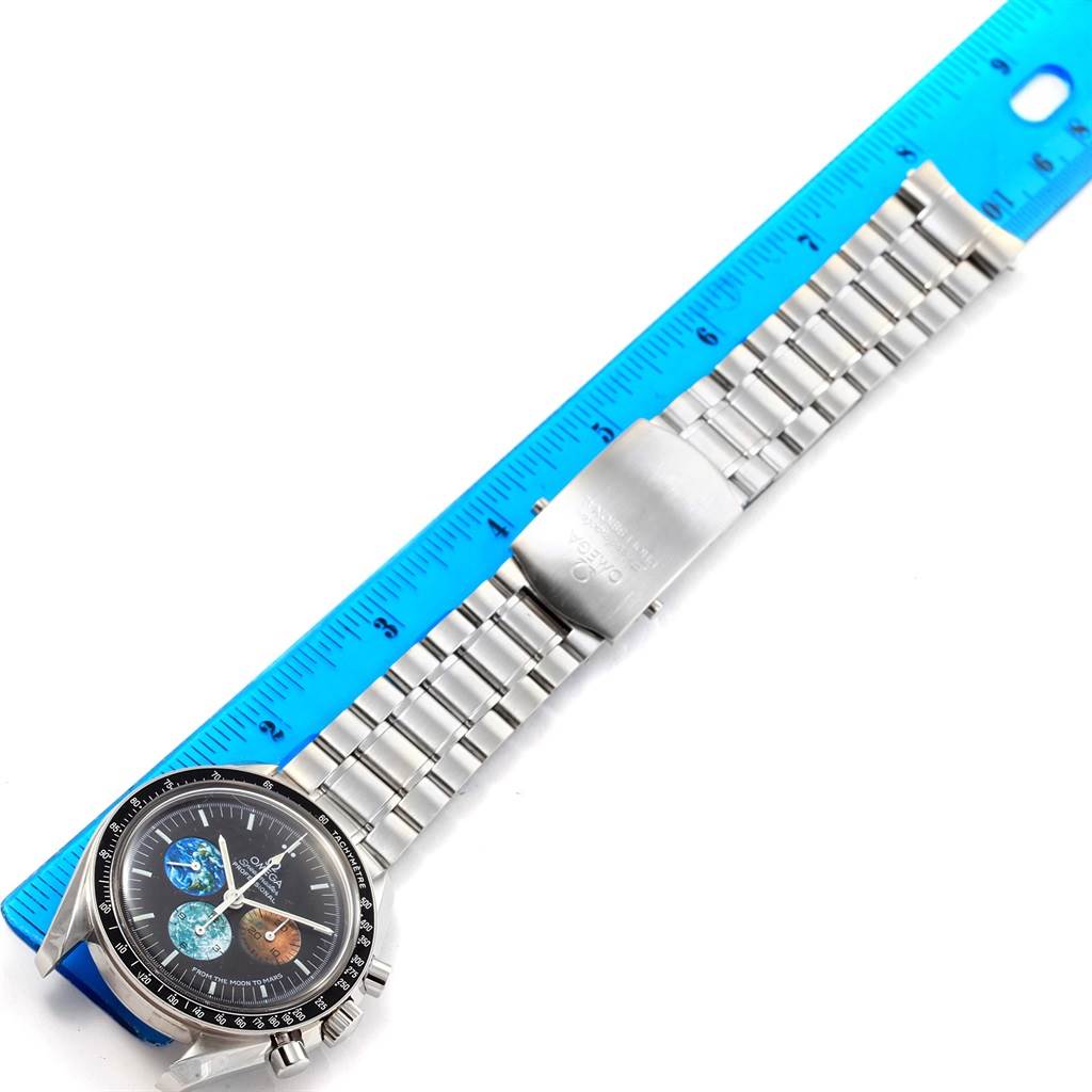 The image shows an Omega Speedmaster 3577.50.00 Men's Stainless Steel Black Dial 3577.50.00 Men's Stainless Steel Black Dial watch laying flat, displaying the face, bezel, and metal bracelet next to a ruler.