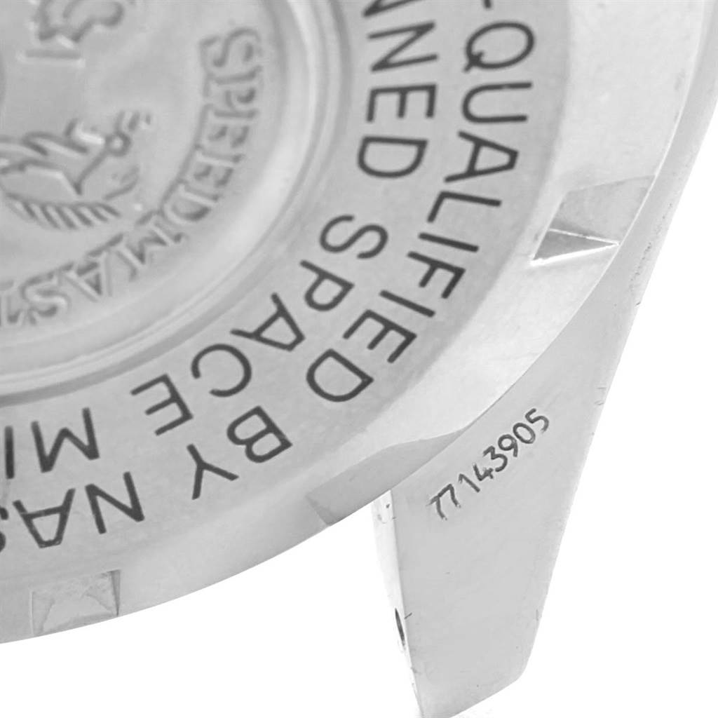 The image shows the case back of an Omega Speedmaster 3577.50.00 Men's Stainless Steel Black Dial 3577.50.00 Men's Stainless Steel Black Dial watch at an angle, highlighting the engraved text.