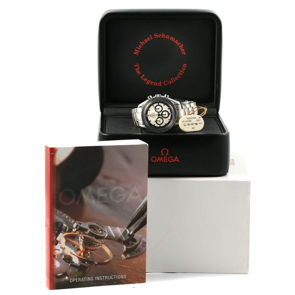 The Omega Speedmaster 3506.31.00 Men's Stainless Steel Silver Dial 3506.31.00 Men's Stainless Steel Silver Dial watch is displayed in its open case with an operating instructions booklet beside it.