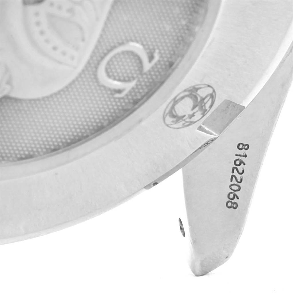 The image shows a close-up of the case back and lug of an Omega Speedmaster 3220.50.00 Men
s Stainless Steel Black Dial 3220.50.00 Men
s Stainless Steel Black Dial watch, highlighting engraved numbers and logos.