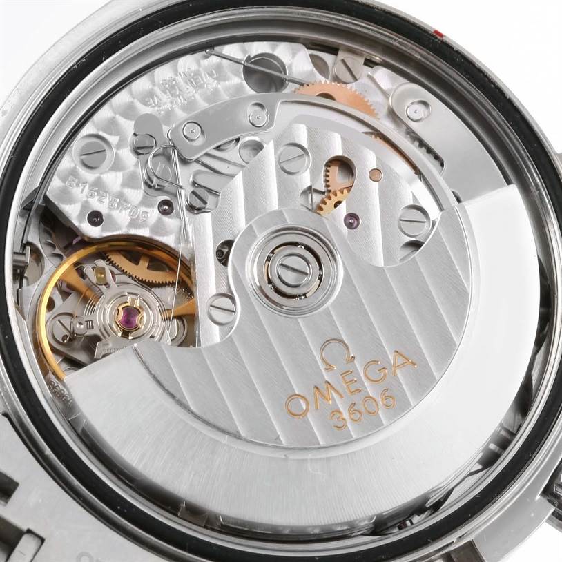 This image shows a close-up view of the Omega Speedmaster 3222.80.00 Men
s Stainless Steel Blue Dial 3222.80.00 Men
s Stainless Steel Blue Dial
s movement, highlighting intricate gears and the rotor with Omega branding.