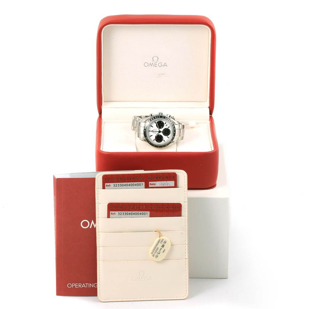 The Omega Speedmaster 323.30.40.40.04.001 Men
s Stainless Steel White Dial 323.30.40.40.04.001 Men
s Stainless Steel White Dial watch is displayed in an open box, with warranty cards and an operating manual shown in front.