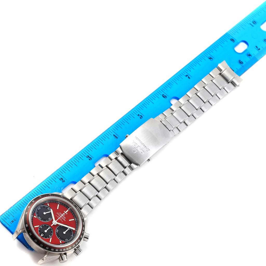 The image shows an Omega Speedmaster 326.30.40.50.11.001 Men
s Stainless Steel Red Dial 326.30.40.50.11.001 Men
s Stainless Steel Red Dial watch from a top-down angle, highlighting the face, bezel, and bracelet.