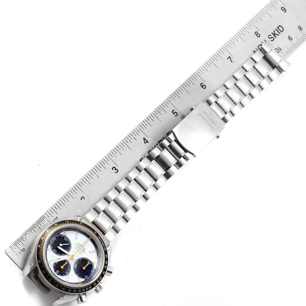 The image shows an Omega Speedmaster 326.30.40.50.04.001 Men
s Stainless Steel White Dial 326.30.40.50.04.001 Men
s Stainless Steel White Dial watch laid flat alongside a ruler, capturing the face and entire metal bracelet from an overhead angle.