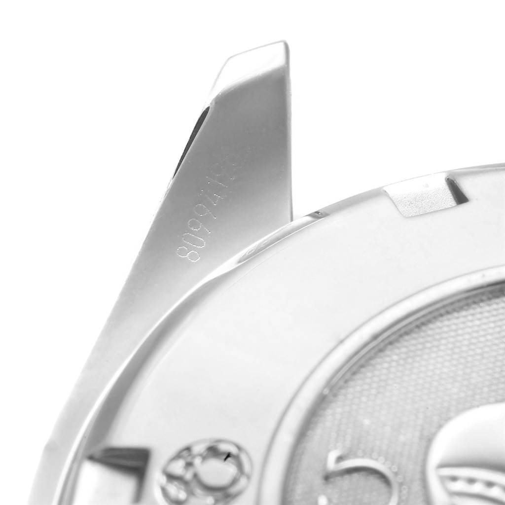 This image shows a close-up view of the case back and a lug of an Omega Speedmaster 323.30.40.40.06.001 Men's Stainless Steel Grey Dial 323.30.40.40.06.001 Men's Stainless Steel Grey Dial watch.